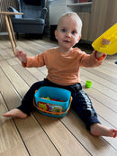 Puttekasse i plast med hank fra Fisher-Price.